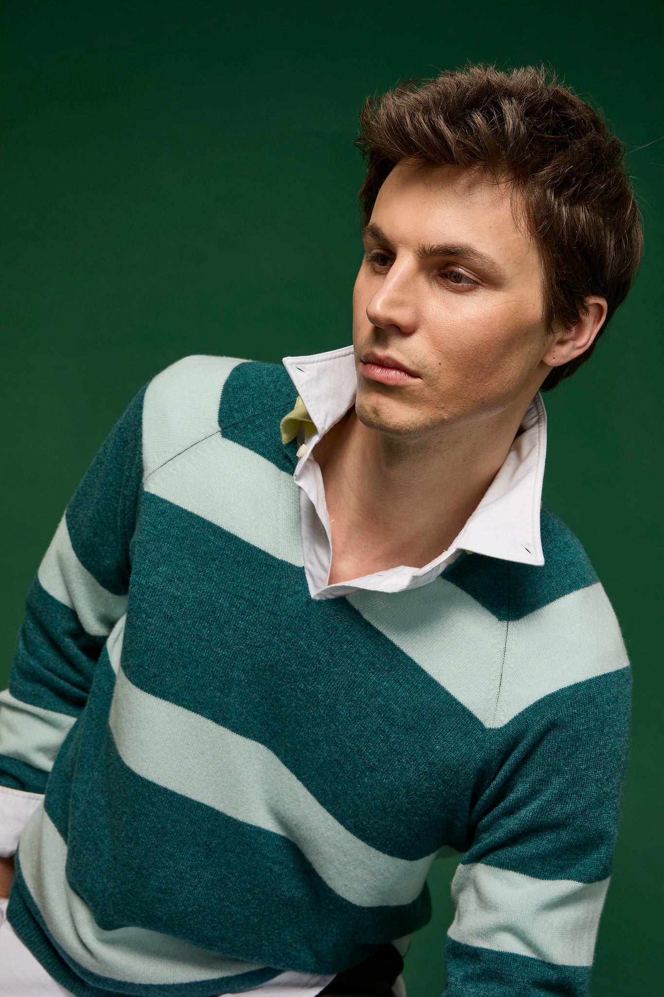 Man wearing a preppy striped knitted rugby top