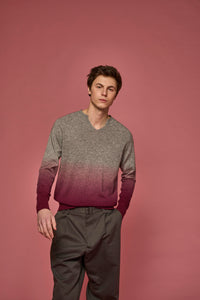 Man wearing a dip-dye sweater in grey and pink
